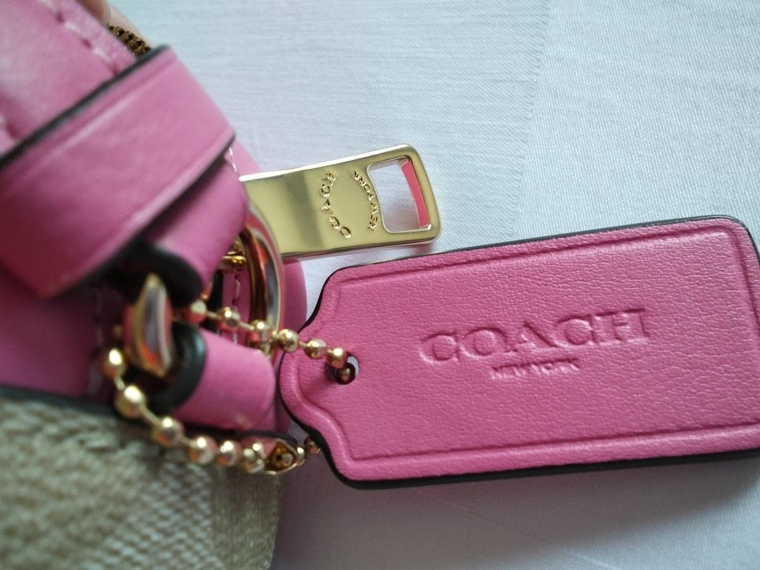 Coach Signature Jamie Camera Bag (Category: Cross-body Bags) located in Cainta. Submitted by roweb (Listing ID 1432884212, Image 3). Description: - Brandnew, bought in Portland, US - Signature Coach pattern - Pink trim and strap - Zip closure - Gold-tone Coach logo and hardware delivery: lalamove or lbc (for province) sf c/o buyer mop: gcash or bpi.