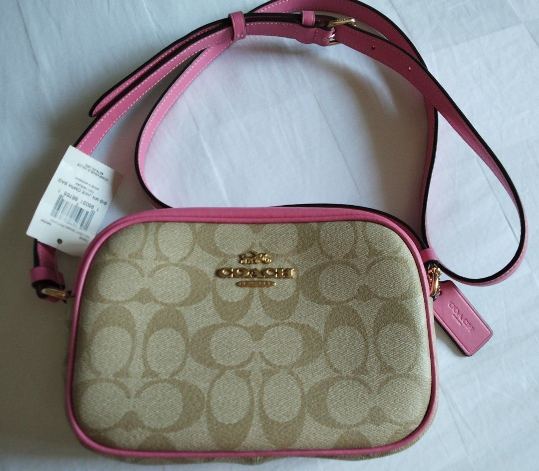 Coach Signature Jamie Camera Bag (Category: Cross-body Bags) located in Cainta. Submitted by roweb (Listing ID 1432884212, Image 1). Description: - Brandnew, bought in Portland, US - Signature Coach pattern - Pink trim and strap - Zip closure - Gold-tone Coach logo and hardware delivery: lalamove or lbc (for province) sf c/o buyer mop: gcash or bpi.
