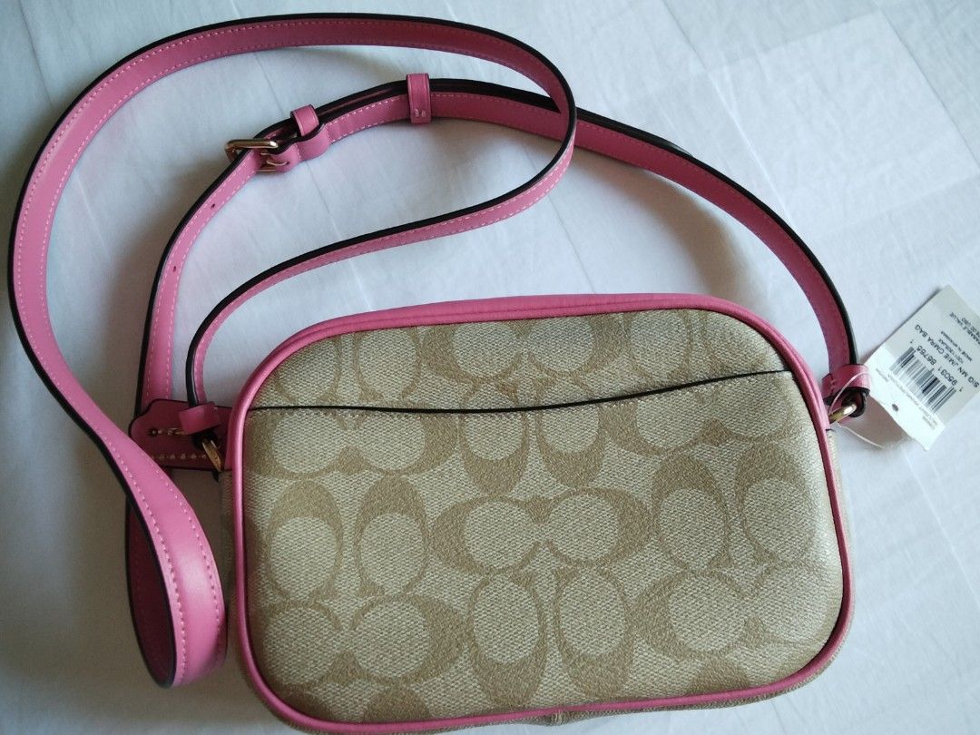 Coach Signature Jamie Camera Bag (Category: Cross-body Bags) located in Cainta. Submitted by roweb (Listing ID 1432884212, Image 2). Description: - Brandnew, bought in Portland, US - Signature Coach pattern - Pink trim and strap - Zip closure - Gold-tone Coach logo and hardware delivery: lalamove or lbc (for province) sf c/o buyer mop: gcash or bpi.