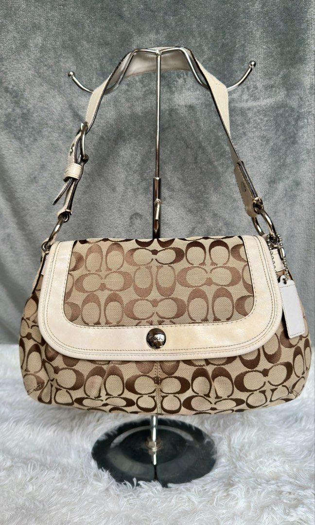 Coach Soho Pleated Flap Shoulder Bag (Category: Luxury Bags & Wallets) located in Manila. Submitted by pamsayat (Listing ID 1423567010, Image 1). Description: Issue/s: • Discoloration on leather (brown stain) • Minimal dirt on canvas • Signs of usage Reminders: • "Slightly" negotiable. Lowballers will be ignored. • This is a preloved and vintage bag. Please expect some imperfections due to age and prior use. • No return or exchange. All sales are