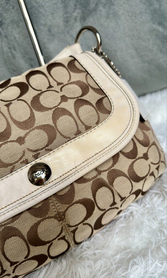 Coach Soho Pleated Flap Shoulder Bag (Category: Luxury Bags & Wallets) located in Manila. Submitted by pamsayat (Listing ID 1423567010, Image 3). Description: Issue/s: • Discoloration on leather (brown stain) • Minimal dirt on canvas • Signs of usage Reminders: • "Slightly" negotiable. Lowballers will be ignored. • This is a preloved and vintage bag. Please expect some imperfections due to age and prior use. • No return or exchange. All sales are