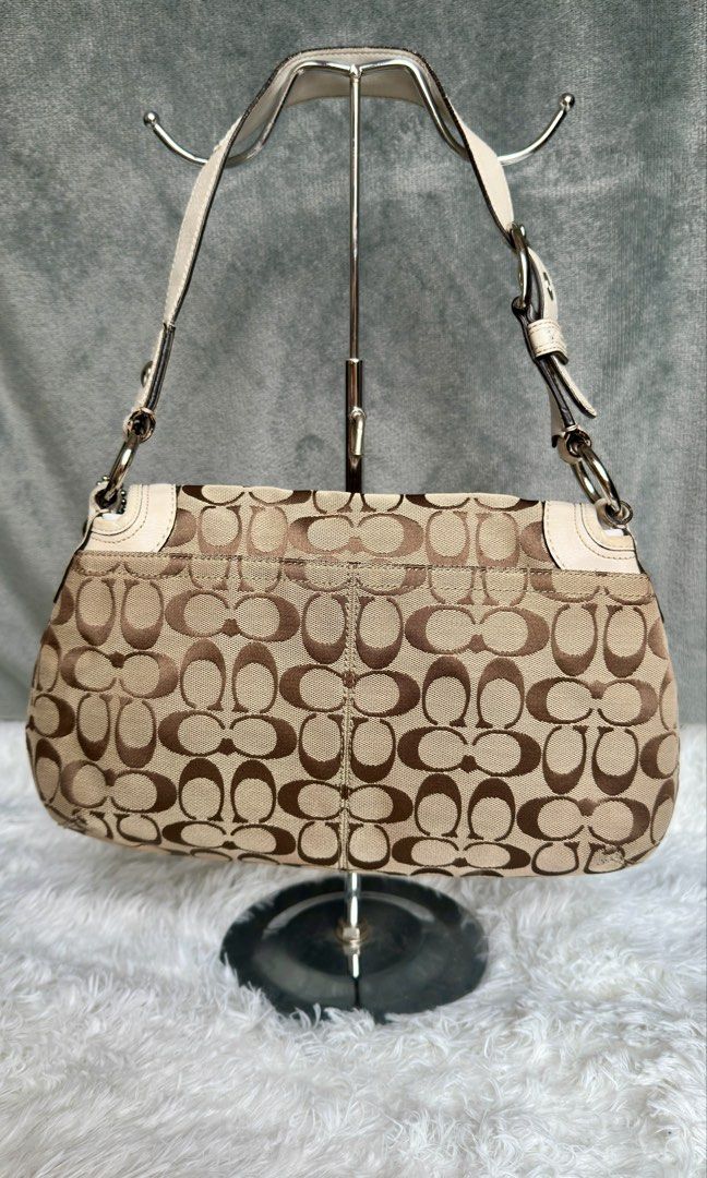 Coach Soho Pleated Flap Shoulder Bag (Category: Luxury Bags & Wallets) located in Manila. Submitted by pamsayat (Listing ID 1423567010, Image 2). Description: Issue/s: • Discoloration on leather (brown stain) • Minimal dirt on canvas • Signs of usage Reminders: • "Slightly" negotiable. Lowballers will be ignored. • This is a preloved and vintage bag. Please expect some imperfections due to age and prior use. • No return or exchange. All sales are