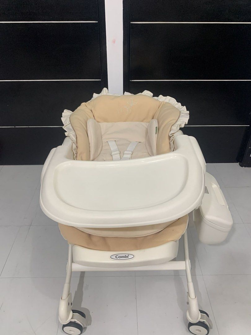 Combi Auto Swing (complete) (Category: Infant Playtime) located in Manila. Submitted by yangrbls (Listing ID 1432841163, Image 1). Description: Combi Auto Swing with music. Perfect for babies and infants. Features a comfortable seat, safety straps, and a tray. Easy to move with wheels and has a storage compartment. Adjustable seat..