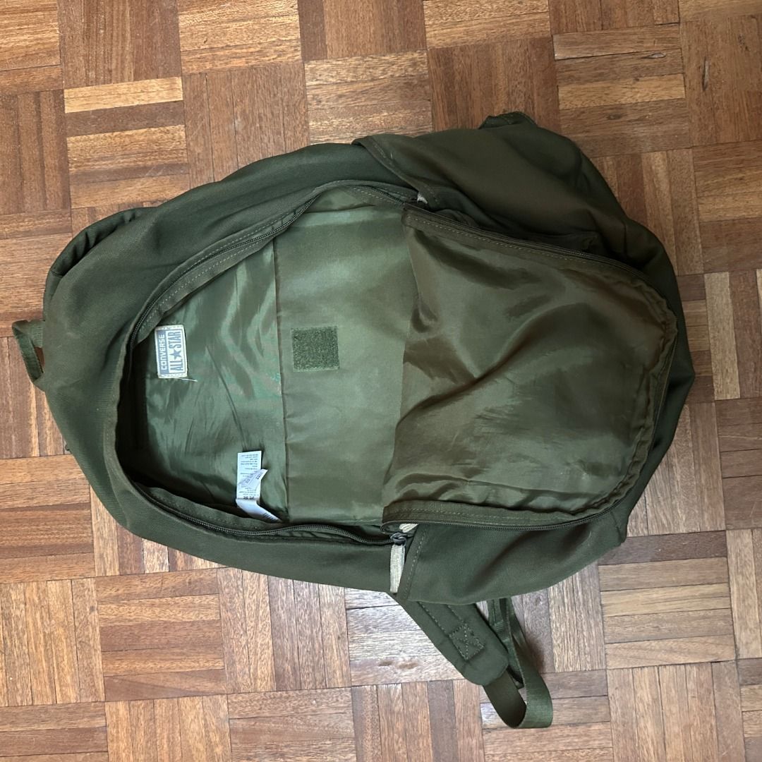 Converse Backpack Olive Green (Category: Backpacks) located in Angeles City. Submitted by kevinsdecluttering (Listing ID 1432823422, Image 3). Description: - ORIGINAL Olive green Converse backpack - Main compartment and front pocket - Green interior lining - Adjustable shoulder straps - Durable fabric - Converse brand tag Honest Issue: Small tear in the inside lining. Can send pictures if you want. 8/10 Condition. Slightly negotiable.