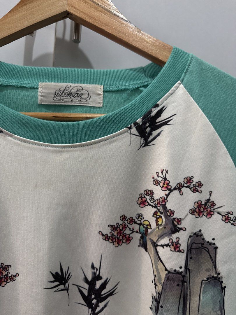 Crew Neck Sweatshirt with Floral Print (Category: Longsleeves) located in Quezon City. Submitted by joiciee (Listing ID 1432812757, Image 2). Description: - Floral print front panel - Mint green sleeves, neckline, and hem - Relaxed fit - Long sleeves - Comfortable for casual wear.