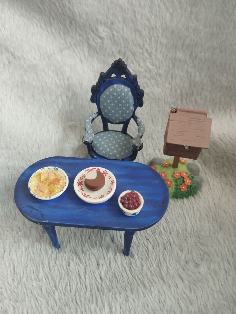 Deagostini Moomin Dollhouse Dining Table and mail box (Category: Figurines & Statues) located in Manila. Submitted by apengdaldoll (Listing ID 1432923333, Image 2). Description: - Deagostini Moomin Miniature dollhouse Dining Room furniture set - Includes: - Blue chair - Oval table with three bowls (food items glued on table) - Moomin Mailbox (damaged) - Perfect for Moomin collectors and 1:12 displays! * This is avery old item and some parts may h