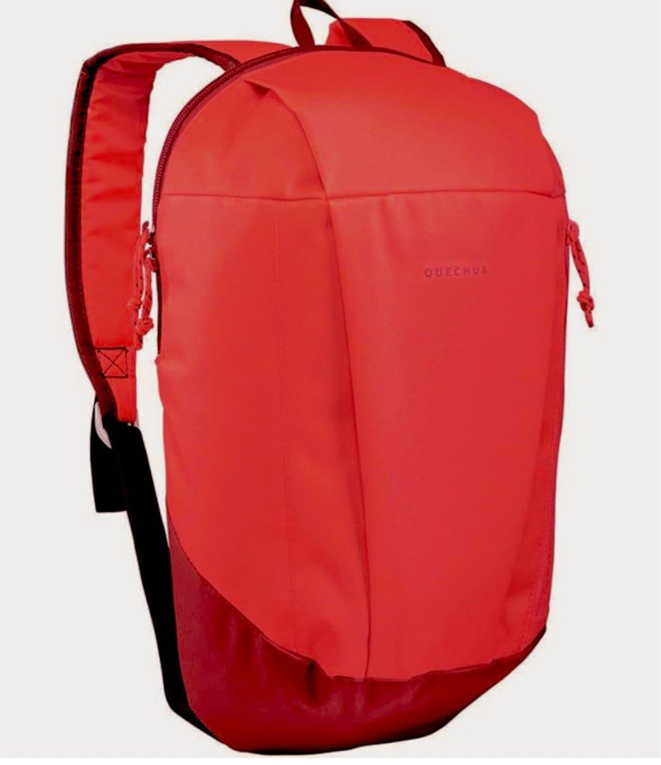 Decathlon Quechua NH100 10L Hiking Backpack (Category: Backpacks) located in Manila. Submitted by rare_goldy (Listing ID 1432824254, Image 1). Description: - Quechua NH100 10L Hiking Backpack - Vibrant red-pink color with a dark red base - Features a zippered main compartment - Includes a smaller front pocket - White interior - Adjustable straps for a comfortable fit - Top handle for easy carrying - Features the Quechua logo.