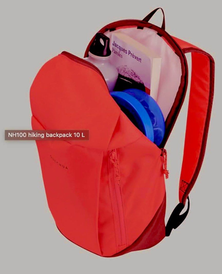 Decathlon Quechua NH100 10L Hiking Backpack (Category: Backpacks) located in Manila. Submitted by rare_goldy (Listing ID 1432824254, Image 2). Description: - Quechua NH100 10L Hiking Backpack - Vibrant red-pink color with a dark red base - Features a zippered main compartment - Includes a smaller front pocket - White interior - Adjustable straps for a comfortable fit - Top handle for easy carrying - Features the Quechua logo.