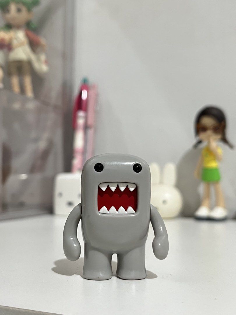 Domo-kun Figure (Category: Designer & Blind Box Toys) located in San Antonio. Submitted by butter.miff (Listing ID 1432934079, Image 1). Description: - Adorable Domo-kun figure! - Features the iconic gray color and red mouth. - Includes the Domo-kun logo on the bottom. - Small size, ideal for display. - Rectangular shape on the back..