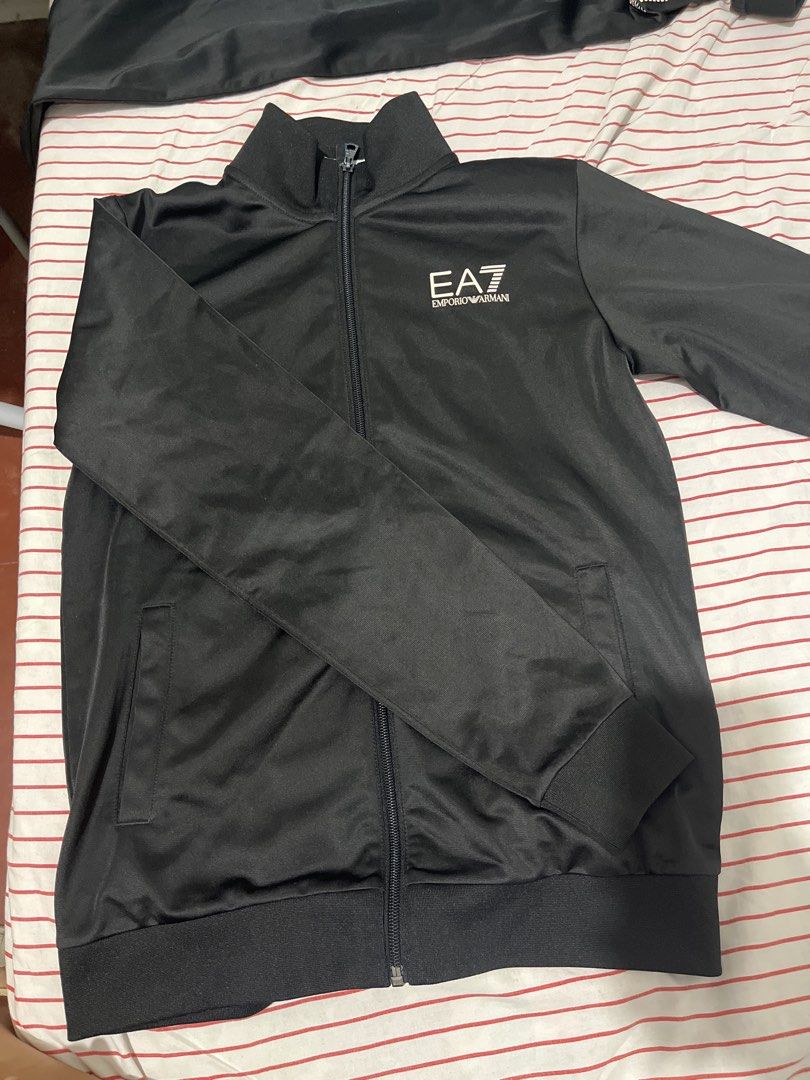 EA7 Emporio Armani Tracksuit Set (Category: Sets & Coordinates) located in Batangas. Submitted by cahrule (Listing ID 1432934394, Image 3). Description: - Black EA7 Emporio Armani tracksuit set - Includes jacket and pants - Size: 14A - Jacket size tag: 160cm - Jacket features full zip and EA7 logo - Pants feature drawstring waist and EA7 logo Just 4,999 TERNO.