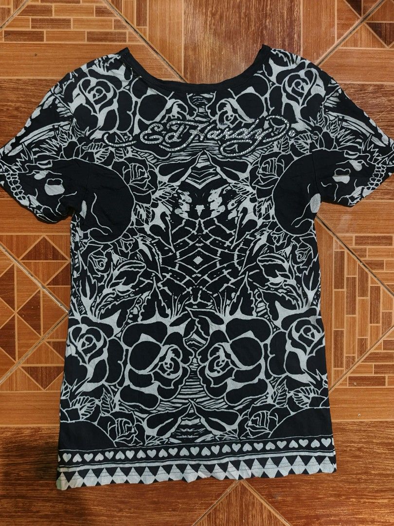 Ed Hardy Skull Rose Graphic Tee XS (Category: Tshirts & Polo Shirts ) located in San Jose del Monte. Submitted by bandidothrift. (Listing ID 1432805962, Image 2). Description: - Ed Hardy black t-shirt - Features a skull and rose graphic - Size: XS - Style: Crew neck, short sleeves - Material: 100% cotton - Care: Hand wash only, do not bleach - Made in China.