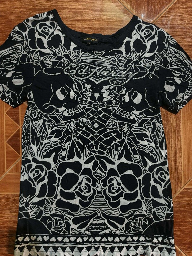 Ed Hardy Skull Rose Graphic Tee XS (Category: Tshirts & Polo Shirts ) located in San Jose del Monte. Submitted by bandidothrift. (Listing ID 1432805962, Image 3). Description: - Ed Hardy black t-shirt - Features a skull and rose graphic - Size: XS - Style: Crew neck, short sleeves - Material: 100% cotton - Care: Hand wash only, do not bleach - Made in China.