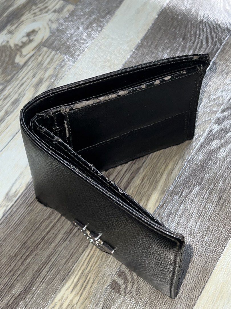 Emporio Armani Black Wallet (Category: Luxury Bags & Wallets) located in Tagum. Submitted by midolli (Listing ID 1432890899, Image 2). Description: - Emporio Armani wallet - Silver logo detail - Multiple card slots - Coin compartment with snap closure - Interior lining shows wear and tear.