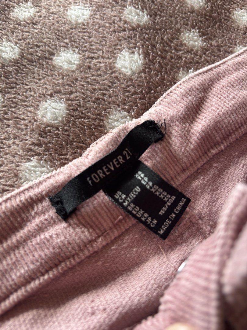 Forever 21 Corduroy Pants XS (Category: Other Bottoms) located in Cebu City. Submitted by conductdisorder (Listing ID 1432870352, Image 1). Description: These Forever 21 corduroy pants are a lovely dusty rose color. They are size XS. The waist measures approximately 28 inches, and the inseam is about 32 inches. The pants have a button and zipper closure, and feature pockets in the front and back..
