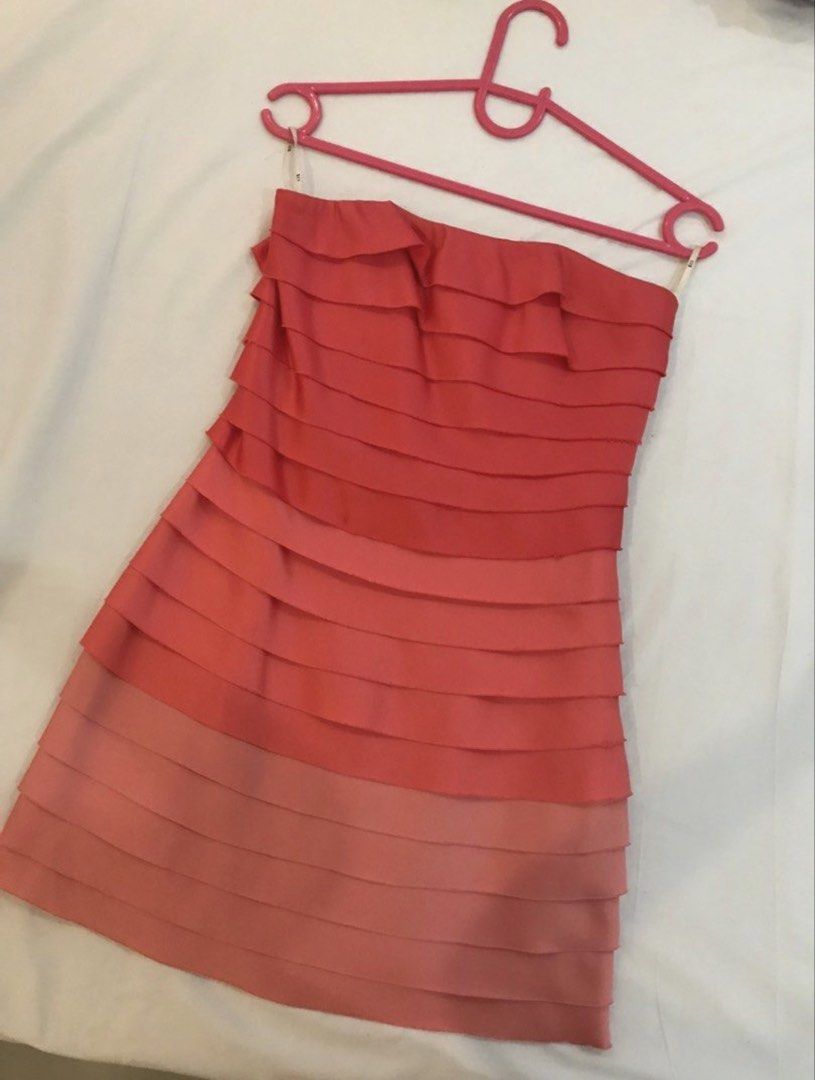 Forever 21 Summer party dress (Category: Dresses) located in Manila. Submitted by harlem55 (Listing ID 1432870040, Image 3). Description: -Satin fabric - Strapless dress - Coral and pink layered ruffle design - Fitted silhouette - Size 2 - Zipper closure - Fabric has a slight sheen - Perfect for special occasions or a night out.