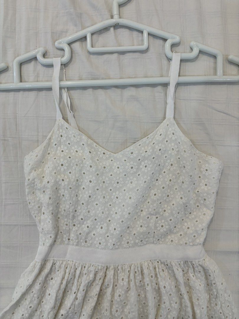 Forever 21 White Eyelet Dress (Category: Dresses) located in Manila. Submitted by harlem55 (Listing ID 1432868678, Image 1). Description: Used but not abused :)) perfect for the summer white eyelet sundress - Forever 21 white eyelet dress - Size: S - Features: - V-neckline - Adjustable straps - Fitted bodice - Flared skirt - Back zipper closure - Perfect for casual wear or summer events.