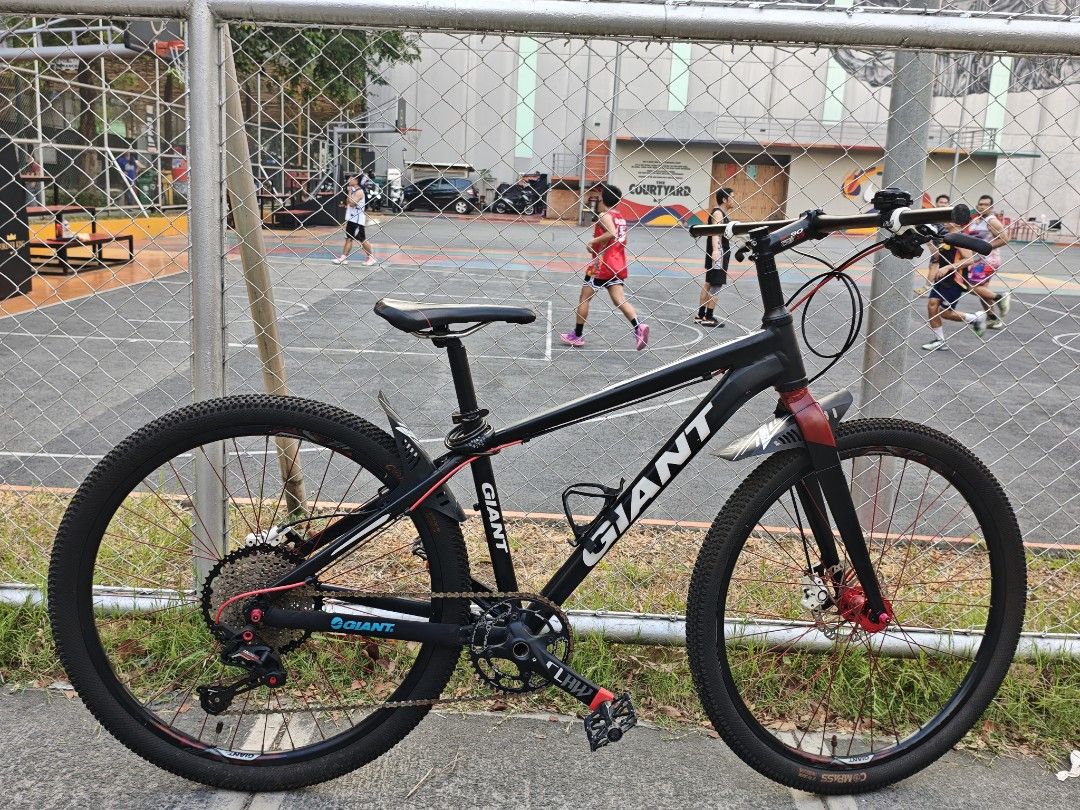 Giant Mountain Bike - UPGRADED (Category: Bicycles) located in Pasay City. Submitted by mitsy42795 (Listing ID 1432940729, Image 1). Description: FIXED PRICE FIXED PRICE Upgraded Giant MTB (Small/27.5er) - Mosso Rigid Fork & Sagmit Parts Quick Specs: Frame: Giant Aluminum (Size S) – Lightweight Fork: Mosso Rigid Fork (M series) – Alluminum Alloy Drivetrain: 1x setup with CLAW Hollowtech Crankset Rear Derailleur: SAGMIT Edison S12 Brakes: Shimano 