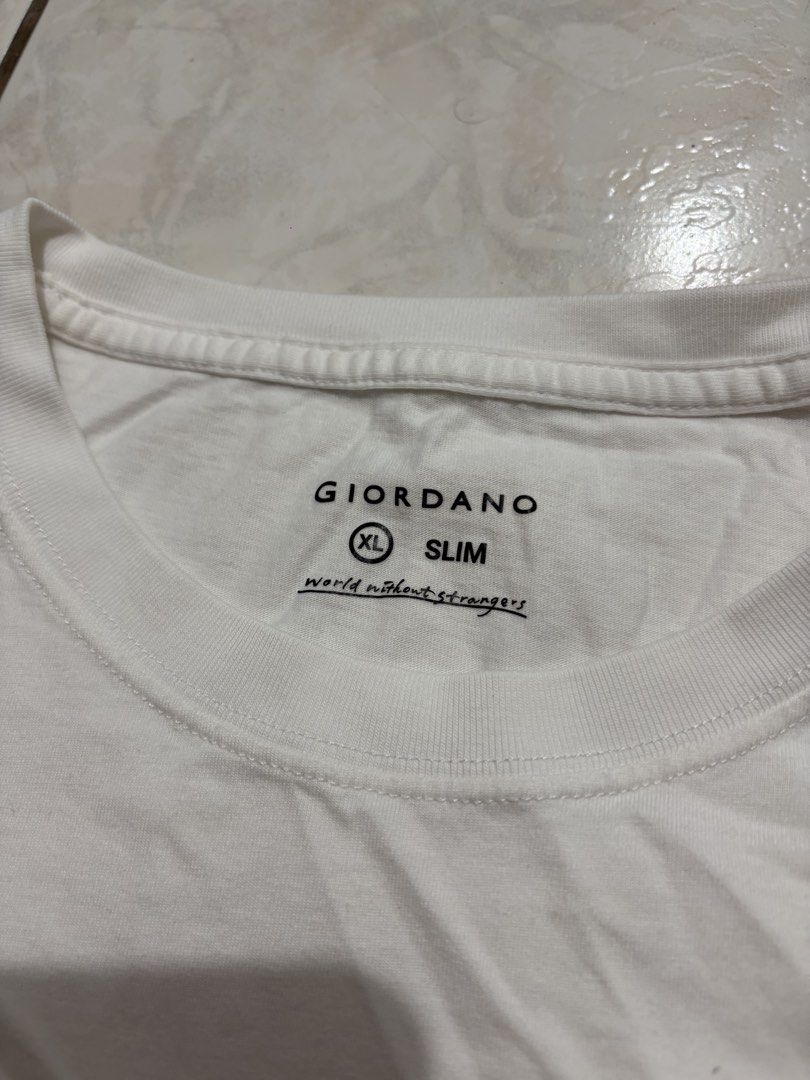 Giordano White T-shirt (Category: Tshirts & Polo Shirts ) located in Manila. Submitted by strangeee (Listing ID 1432974622, Image 2). Description: Giordano White Shirt with Logo Length: 25.5 Shoulders: 15.5 Sleeves: 8 Chest: 19 Size on tag: XL (slimfit) fits: S-M - Only used once RFS: Decluttering personal items from my closet, not thrifted. .