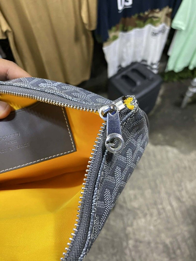 Goyard Clutch Bag (Category: Luxury Bags & Wallets) located in Polomolok. Submitted by warmfire.3185dd (Listing ID 1432880529, Image 3). Description: - Authentic Goyard clutch bag - Signature grey Goyardine canvas - Yellow fabric interior lining - Secure zipper closure - Includes leather tag with "GOYARD PARIS MADE IN FRANCE" - Serial number: STU020051.