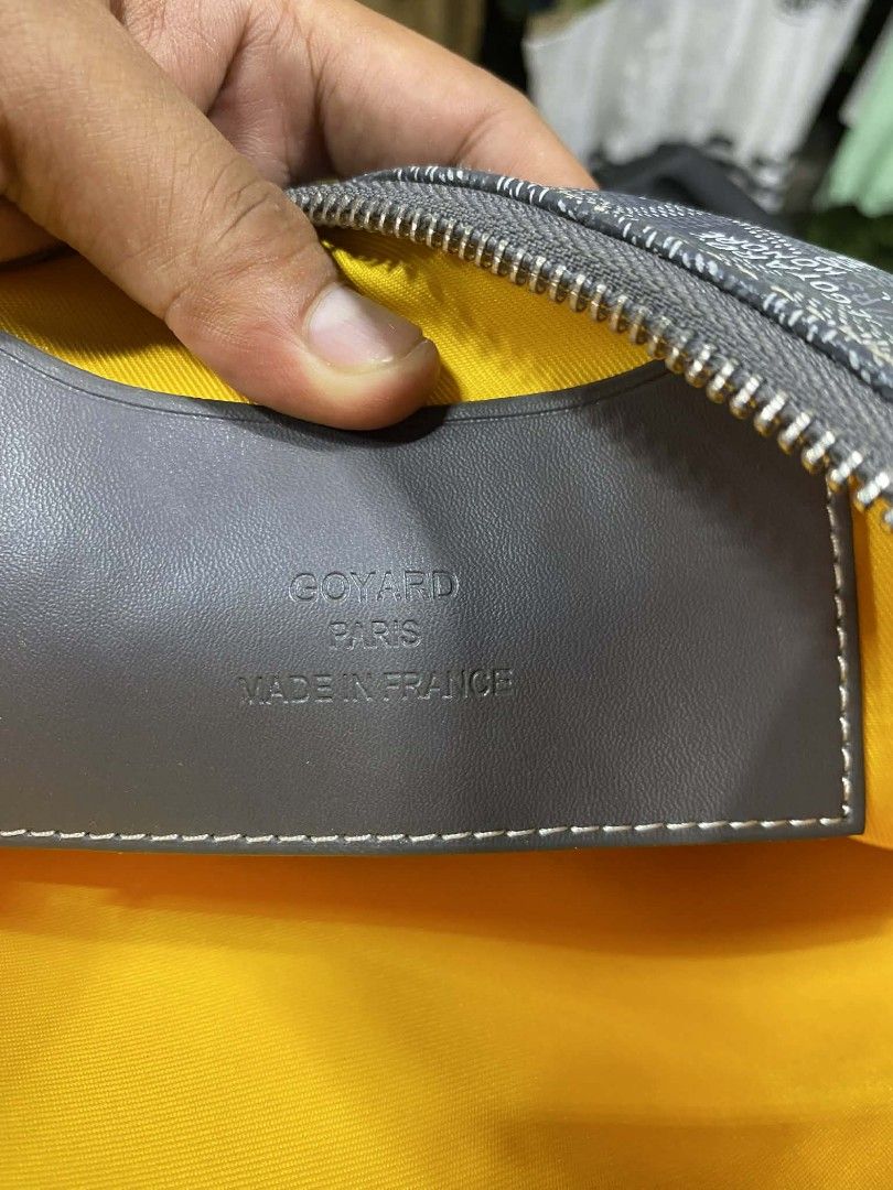 Goyard Clutch Bag (Category: Luxury Bags & Wallets) located in Polomolok. Submitted by warmfire.3185dd (Listing ID 1432880529, Image 2). Description: - Authentic Goyard clutch bag - Signature grey Goyardine canvas - Yellow fabric interior lining - Secure zipper closure - Includes leather tag with "GOYARD PARIS MADE IN FRANCE" - Serial number: STU020051.