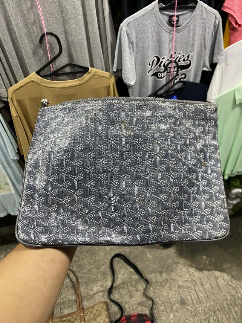 Goyard Clutch Bag (Category: Luxury Bags & Wallets) located in Polomolok. Submitted by warmfire.3185dd (Listing ID 1432880529, Image 1). Description: - Authentic Goyard clutch bag - Signature grey Goyardine canvas - Yellow fabric interior lining - Secure zipper closure - Includes leather tag with "GOYARD PARIS MADE IN FRANCE" - Serial number: STU020051.