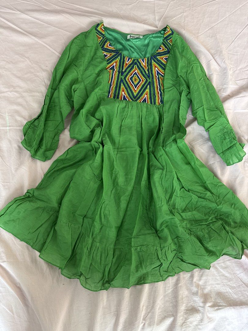 Green Beaded Dress (Category: Dresses) located in Manila. Submitted by aimelamode (Listing ID 1432869456, Image 1). Description: - Green dress - Embroidered neckline with geometric pattern (yellow, blue, white) - Long sleeves - Flowing skirt - Lightweight fabric.