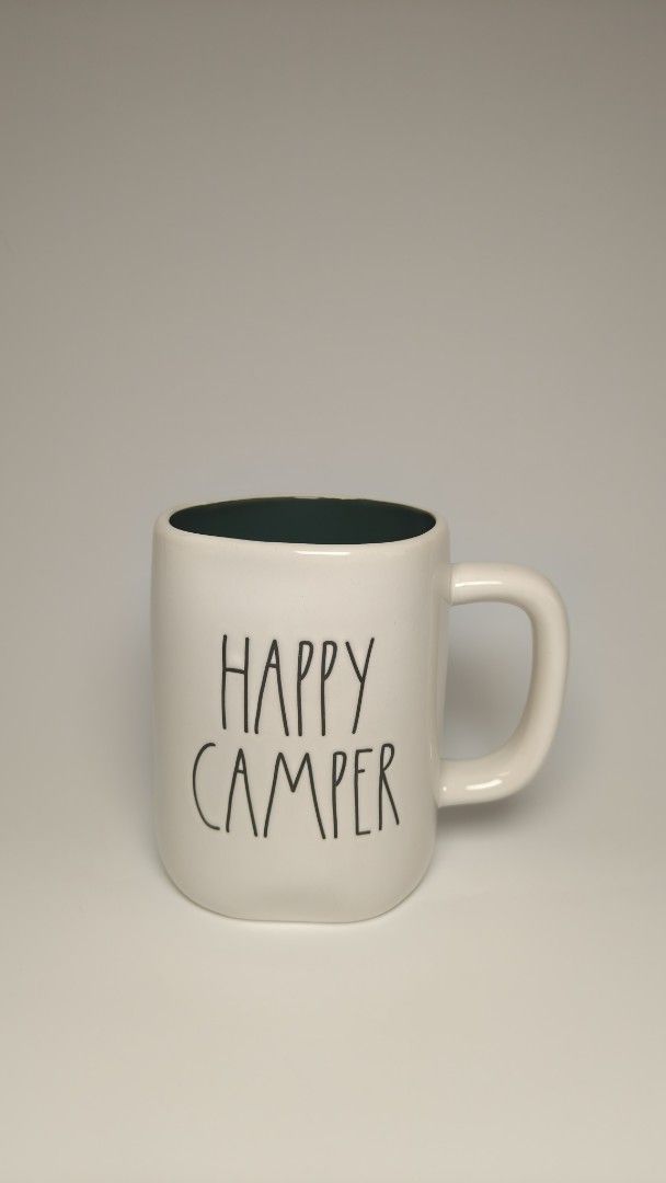 Happy Camper Mug (Category: Coffee & Tea Tableware) located in Cavite. Submitted by phtmt (Listing ID 1432964591, Image 1). Description: Rae Dunn "Happy Camper" mug - Features a camper illustration - White exterior, dark green interior - Includes a handle - Perfect for your favorite drink.