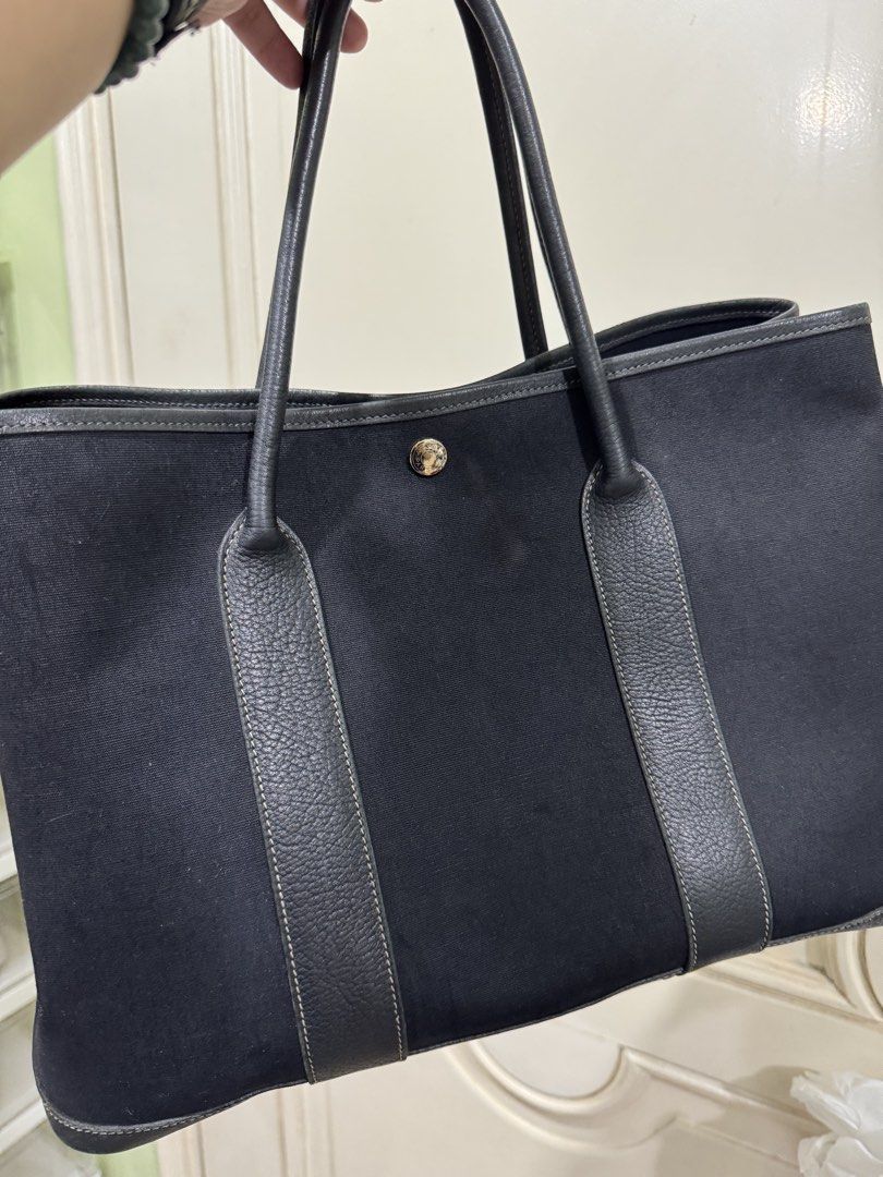 Hermes Garden Party 30 (Category: Luxury Bags & Wallets) located in Manila. Submitted by personalprelovedmnl (Listing ID 1432928568, Image 1). Description: - Black tote bag - Leather trim and handles - Snap closure - Leather detailing on the bottom - Shows wear and tear.