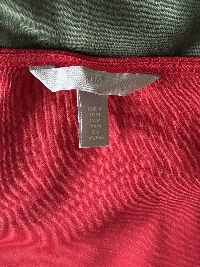 H&M Red Long Sleeve Top - Size M (Category: Blouses) located in Mandaluyong City. Submitted by bei_g (Listing ID 1432859506, Image 2). Description: - H&M top - Vibrant red color - Heart neckline - Long sleeves - Size: M - Versatile for various outfits.