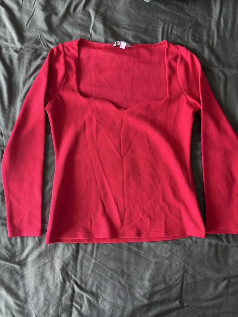 H&M Red Long Sleeve Top - Size M (Category: Blouses) located in Mandaluyong City. Submitted by bei_g (Listing ID 1432859506, Image 1). Description: - H&M top - Vibrant red color - Heart neckline - Long sleeves - Size: M - Versatile for various outfits.