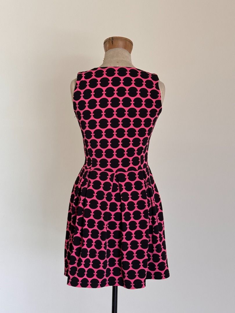 Hot Pink Mod Mini Dress - Stretch Fabric (Category: Dresses) located in Botolan. Submitted by kstyled (Listing ID 1432825239, Image 2). Description: * Style: Fit-and-flare silhouette, sleeveless, square neck. * Pattern: Black geometric/retro circle print. * Features: Discrete side zipper, stretchy comfortable material. * Condition: Excellent pre-loved condition. No tags. Measured Flat (in inches) Pit to pit = 16 Waist = 14 Length = 32.