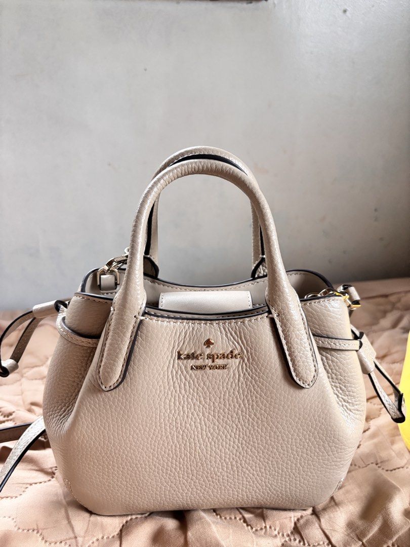 Kate Spade Dumpling Mini Satchel in Light Sand (Category: Luxury Bags & Wallets) located in Manila. Submitted by dyonii (Listing ID 1432830591, Image 1). Description: Kate Spade Dumpling Mini Satchel in Light Sand - Selling for ₱4,000, originally bought for ₱6,690 - Used only once - Neutral beige pebbled leather - Top handles and detachable shoulder strap - Gold-tone Kate Spade logo - Interior pocket.