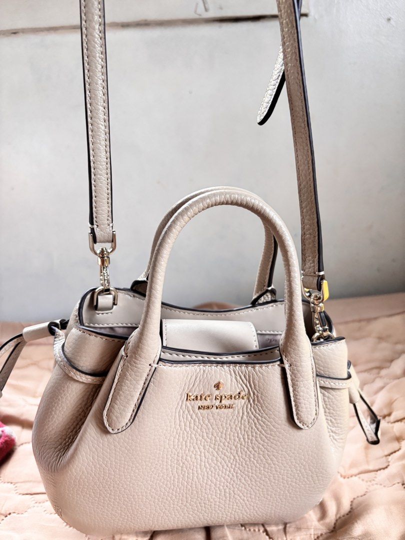 Kate Spade Dumpling Mini Satchel in Light Sand (Category: Luxury Bags & Wallets) located in Manila. Submitted by dyonii (Listing ID 1432830591, Image 3). Description: Kate Spade Dumpling Mini Satchel in Light Sand - Selling for ₱4,000, originally bought for ₱6,690 - Used only once - Neutral beige pebbled leather - Top handles and detachable shoulder strap - Gold-tone Kate Spade logo - Interior pocket.