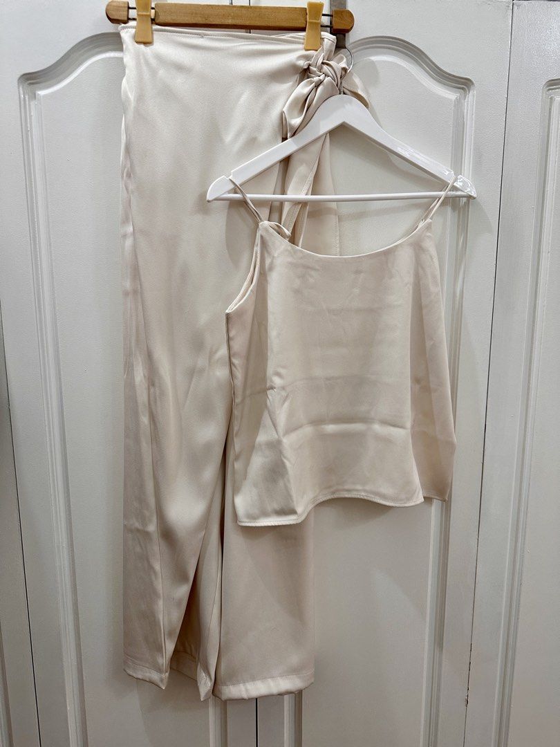 Korean Satin Cami Top and Wrap Pants Set (Category: Sets or Coordinates) located in Manila. Submitted by kspassion (Listing ID 1432803470, Image 3). Description: - Satin cami top and wrap pants set - Features spaghetti strap top and wide-leg pants - Wrap-around tie detail - Available colors: cream, olive green, dark brown - Great for casual and evening wear Free size fits up to xl Waist 24-32” garterized waist.