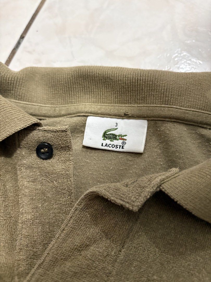 Lacoste Textured Brown Polo Shirt (Category: Tshirts & Polo Shirts ) located in Manila. Submitted by strangeee (Listing ID 1432973731, Image 3). Description: Lacoste Textured Brown Polo Shirt Length: 26.5 Shoulders: 17.5 Sleeves: 9 Chest: 20.5 Size: M Can fit: S-M Issue: slight discoloration lower part (not noticeable) RFS: Decluttering personal items from my closet, not thrifted. .
