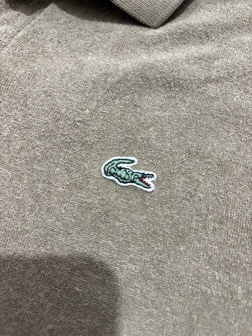 Lacoste Textured Brown Polo Shirt (Category: Tshirts & Polo Shirts ) located in Manila. Submitted by strangeee (Listing ID 1432973731, Image 2). Description: Lacoste Textured Brown Polo Shirt Length: 26.5 Shoulders: 17.5 Sleeves: 9 Chest: 20.5 Size: M Can fit: S-M Issue: slight discoloration lower part (not noticeable) RFS: Decluttering personal items from my closet, not thrifted. .