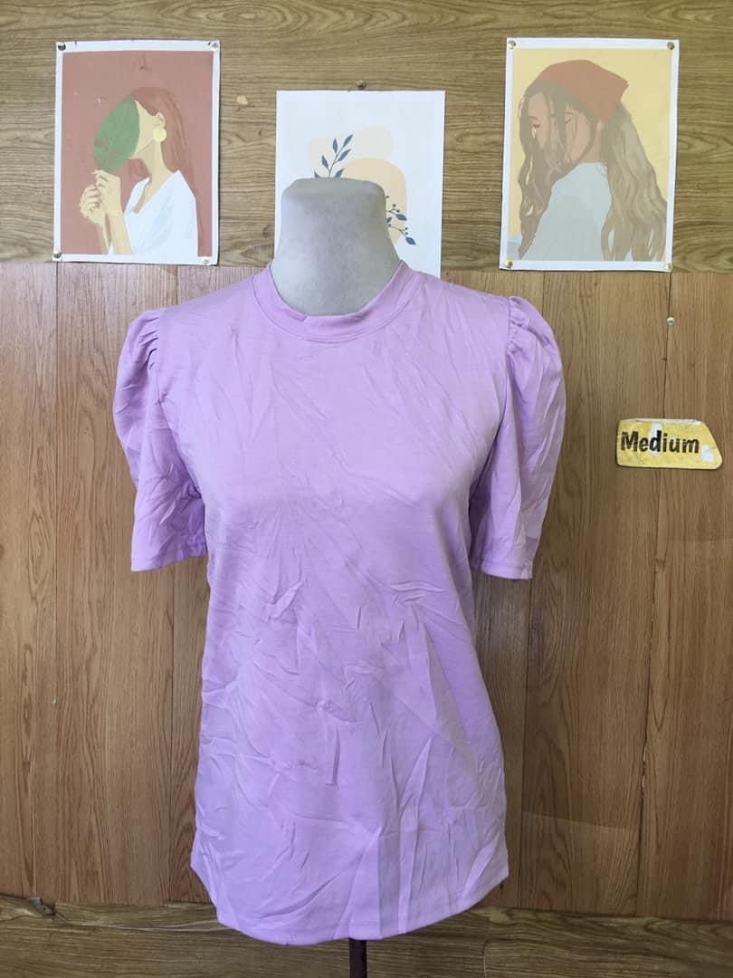 Lavender Puff Sleeve Top - Medium (Category: Blouses) located in Cabadbaran. Submitted by KsGoodFind (Listing ID 1432866369, Image 1). Description: - Lavender top - Size: Medium - Features: Round neckline, short puff sleeves - Fabric: Lightweight, ideal for warm weather - Design: Solid color, slightly curved hemline.