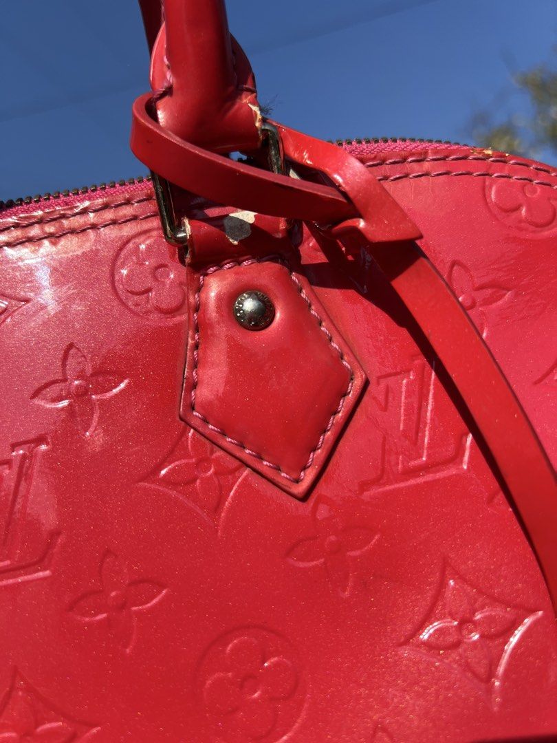 Louis Vuitton Alma BB Red (Category: Luxury Bags & Wallets) located in Manila. Submitted by vastriver-12e2c3 (Listing ID 1432872963, Image 3). Description: - Authentic Louis Vuitton Alma BB - Red patent leather - Iconic LV monogram pattern - Top handle and detachable strap - Pink fabric interior with pocket - Zipper closure - Metal feet - Made in France.