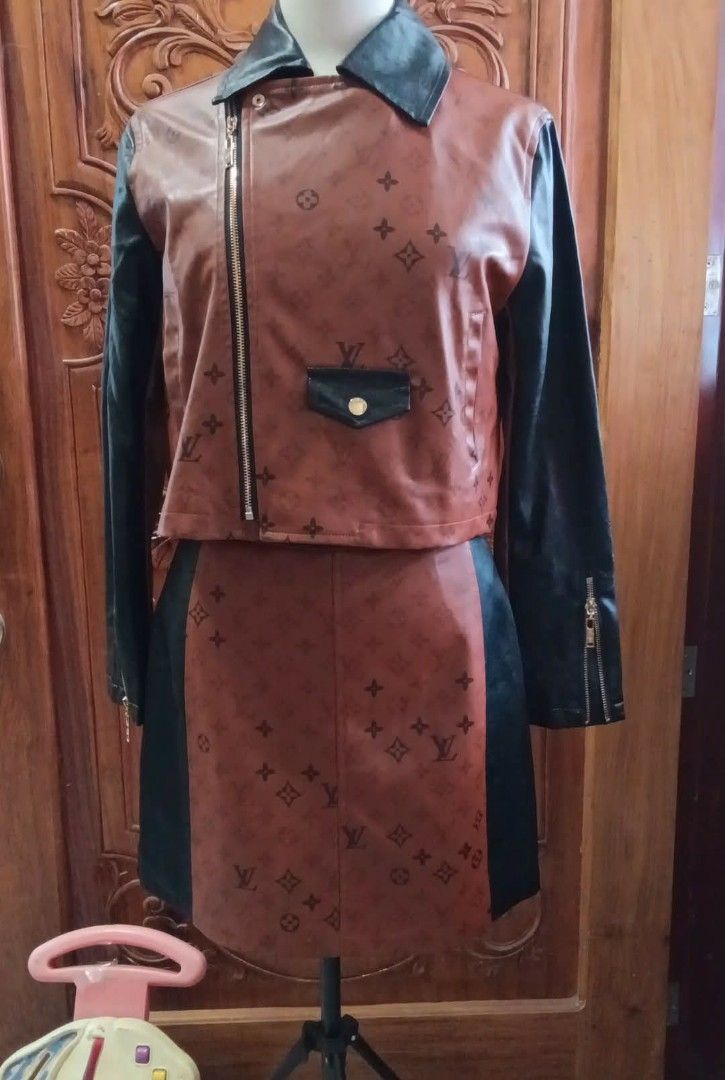 Louis Vuitton Brown Leather Jacket and Skirt Set (Category: Luxury Apparel) located in Cabanatuan. Submitted by almaespino24263 (Listing ID 1432911656, Image 3). Description: - Two-piece outfit: brown leather jacket and skirt - Jacket: biker style, zipper closure, black sleeves, small pocket design, Louis Vuitton logo, gold hardware - Skirt: matching design, black panels, Louis Vuitton logo - Gold hardware on both pieces 3 items sold - 1 left ava