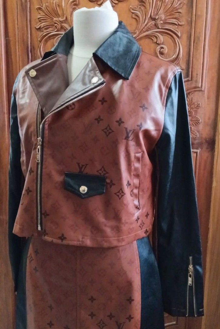 Louis Vuitton Brown Leather Jacket and Skirt Set (Category: Luxury Apparel) located in Cabanatuan. Submitted by almaespino24263 (Listing ID 1432911656, Image 2). Description: - Two-piece outfit: brown leather jacket and skirt - Jacket: biker style, zipper closure, black sleeves, small pocket design, Louis Vuitton logo, gold hardware - Skirt: matching design, black panels, Louis Vuitton logo - Gold hardware on both pieces 3 items sold - 1 left ava