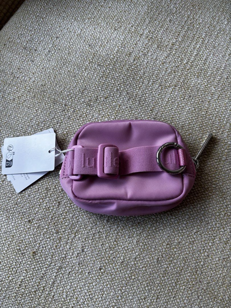 Lululemon Everywhere Belt Bag Nano (Category: Cross-body Bags) located in Taguig. Submitted by anik.ph (Listing ID 1432861496, Image 2). Description: - Original, bought this in Japan - Lululemon Everywhere Belt Bag Nano - Pink color - Compact and stylish design - Zippered closure - Small strap on the back - Silver-tone ring - Features the Lululemon logo.