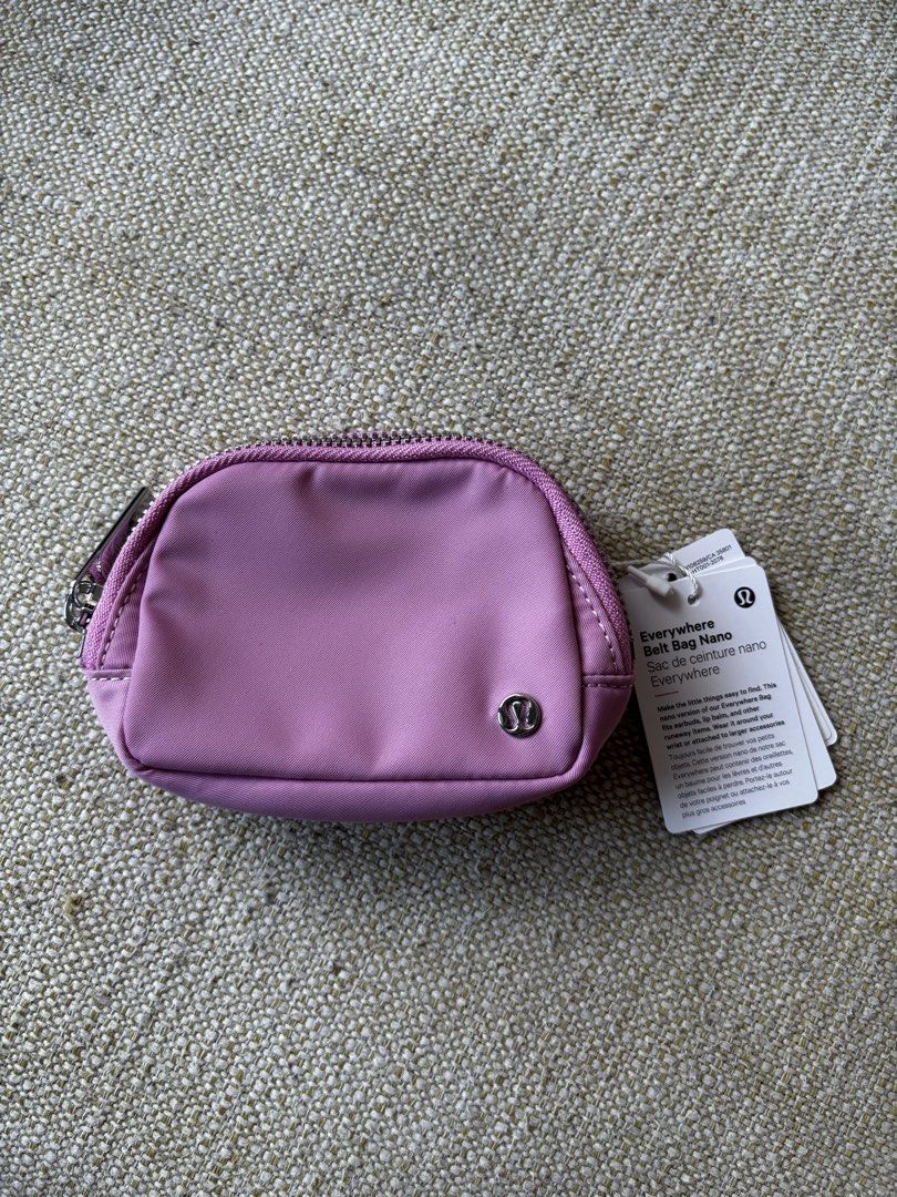 Lululemon Everywhere Belt Bag Nano (Category: Cross-body Bags) located in Taguig. Submitted by anik.ph (Listing ID 1432861496, Image 1). Description: - Original, bought this in Japan - Lululemon Everywhere Belt Bag Nano - Pink color - Compact and stylish design - Zippered closure - Small strap on the back - Silver-tone ring - Features the Lululemon logo.