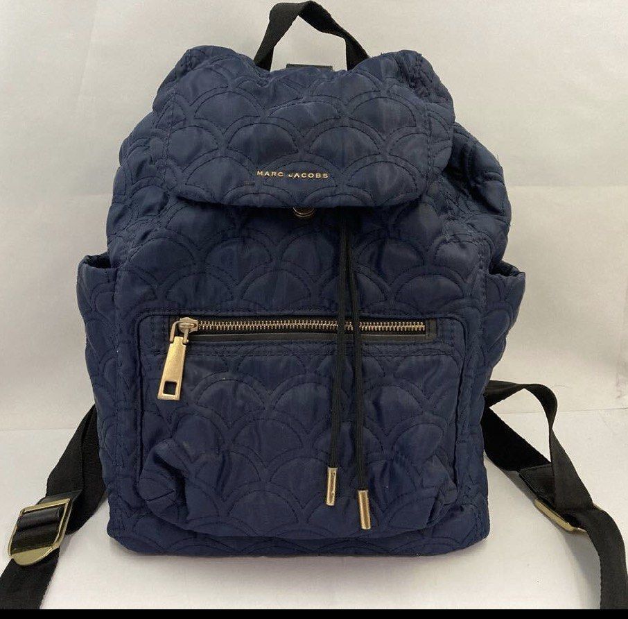 Marc Jacobs Quilted Nylon Backpack (Navy Blue) | Gold Hardware (Category: Backpacks) located in Davao. Submitted by my_picks (Listing ID 1432955710, Image 1). Description: A stylish and functional everyday piece from Marc Jacobs 💙 Lightweight, spacious, and effortlessly chic — perfect for daily errands, travel, or casual days out. • Authentic Marc Jacobs • Quilted nylon design (lightweight yet durable) • Elegant navy blue color • Gold-tone hardw