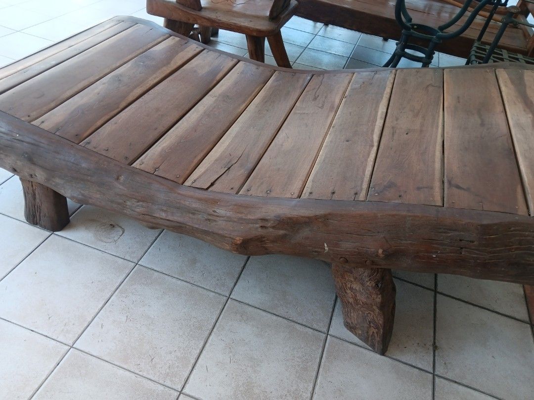 Molave Wooden Bench with Natural Edge (Category: Chairs) located in Las Pinas. Submitted by jesus1smysavi0r (Listing ID 1432857991, Image 2). Description: - Natural edge wooden bench - Constructed with wooden planks and sturdy wooden legs - Curved shape - Suitable for indoor or outdoor use - Rich, dark wood color - Well-crafted and durable.