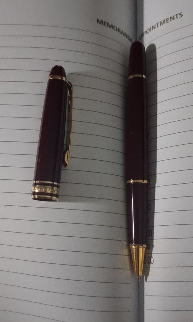 Montblanc Burgundy Pen (Category: Luxury Accessories) located in Quezon City. Submitted by expe888 (Listing ID 1432972083, Image 2). Description: - Burgundy Montblanc pen - Gold-colored accents - Sleek design - Perfect for everyday use - Great gift option.
