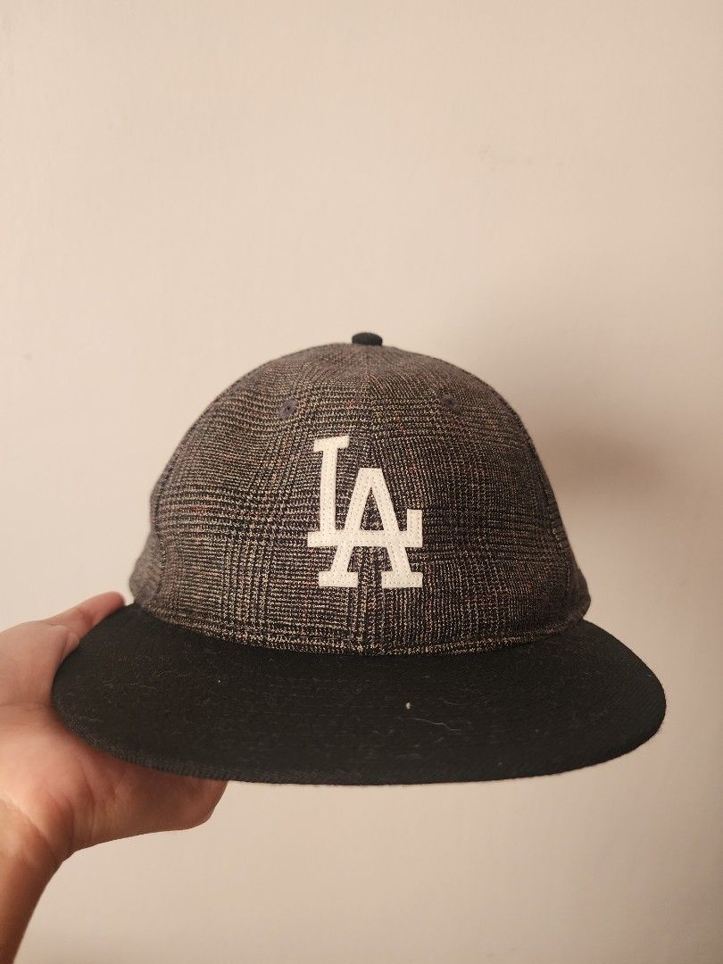 New Era LA Dodgers 59Fifty Plaid (Category: Caps & Hats) located in Santo Tomas. Submitted by mieu_declutters (Listing ID 1432890951, Image 1). Description: - Authentic - Bought in Malaysia - Features the LA Dodgers logo - Stylish plaid pattern on the crown - Classic black brim - Size: 7 1/8 - Includes New Era logo on the side and MLB logo at the back - Comes with a New Era tote bag.