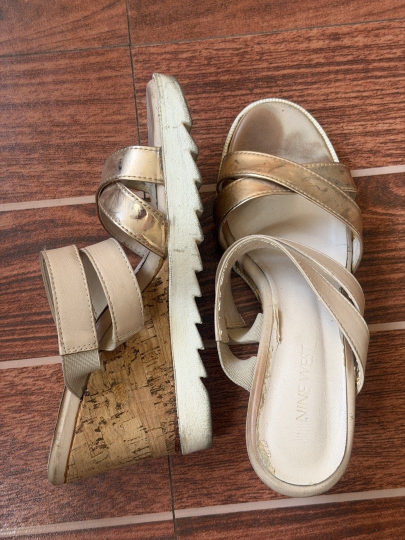 Nine West Gold Wedge Sandals (Category: Wedges) located in Cavite. Submitted by peppermintsss (Listing ID 1432794050, Image 2). Description: - Nine West wedge sandals - Gold color - Criss-cross strap design - Slip-on style - Cork-like sole - Wedge heel ‼️Shows wear on footbed and sole.