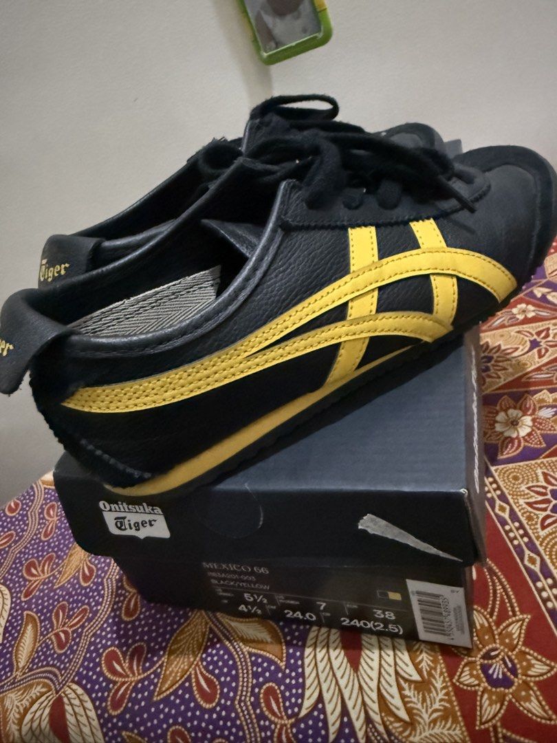Onitsuka Tiger Mexico 66 Black/Yellow (Category: Sneakers) located in Quezon City. Submitted by msaisa (Listing ID 1432937681, Image 2). Description: Onitsuka Tiger Mexico 66 sneakers in black and yellow. The shoes come with their original box. The size is 4.5 for women, 7 for men, and 38 for EUR. The shoes have black laces and the Onitsuka Tiger logo on the heel and insole. The soles are black with a textured pattern..