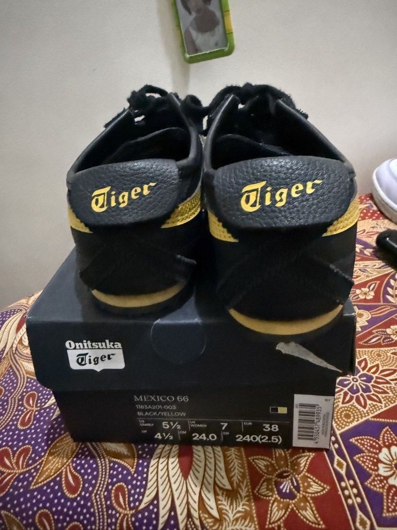 Onitsuka Tiger Mexico 66 Black/Yellow (Category: Sneakers) located in Quezon City. Submitted by msaisa (Listing ID 1432937681, Image 1). Description: Onitsuka Tiger Mexico 66 sneakers in black and yellow. The shoes come with their original box. The size is 4.5 for women, 7 for men, and 38 for EUR. The shoes have black laces and the Onitsuka Tiger logo on the heel and insole. The soles are black with a textured pattern..