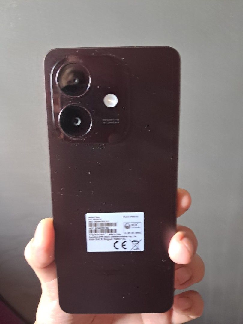 OPPO Phone with Case (Category: OPPO) located in Manila. Submitted by docards1102 (Listing ID 1432877743, Image 3). Description: - Black OPPO phone - Textured back - Dual-camera setup - Includes black case - Ridged case design - OPPO logo visible.